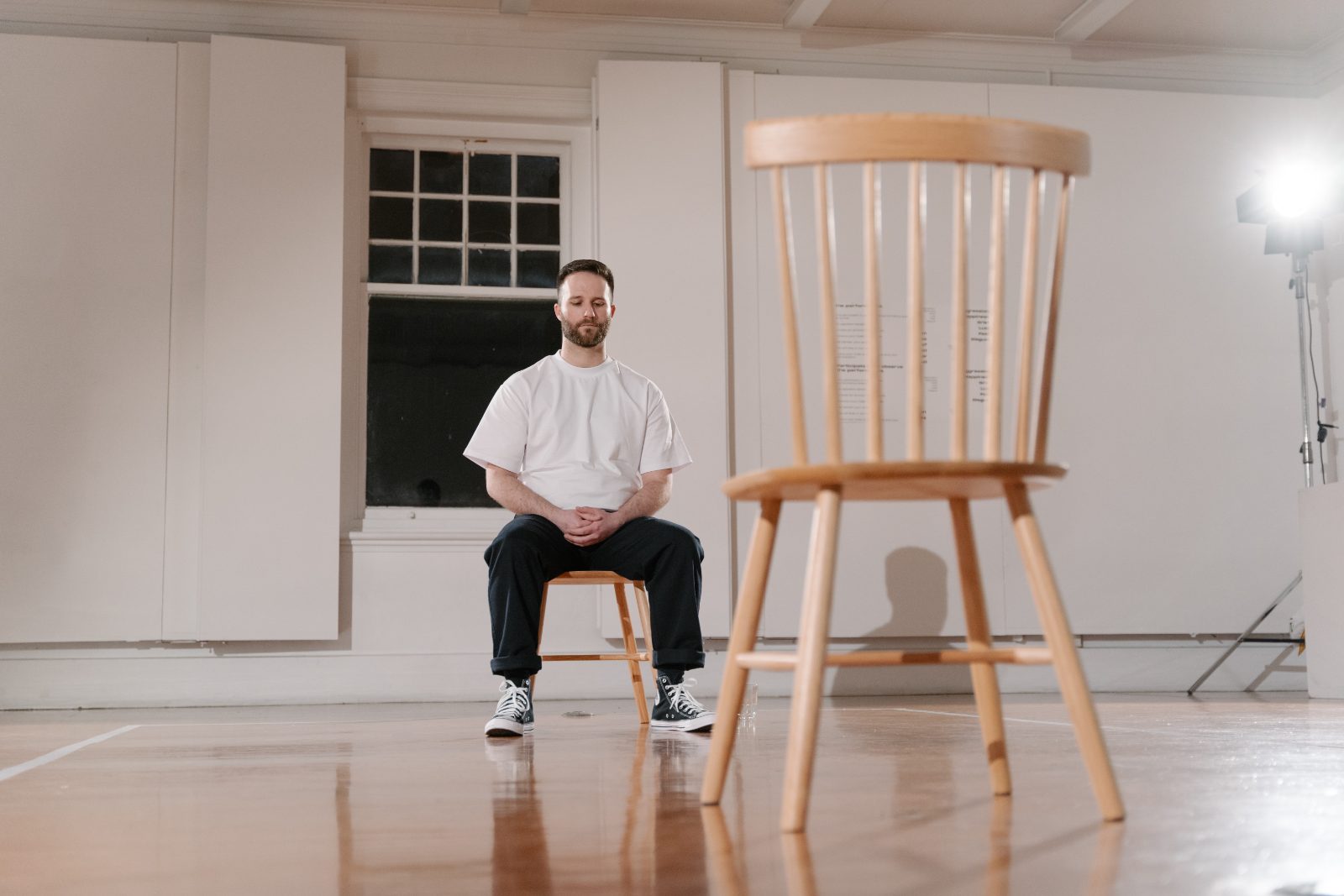 Hamish Annan seated opposite an empty chair in Access